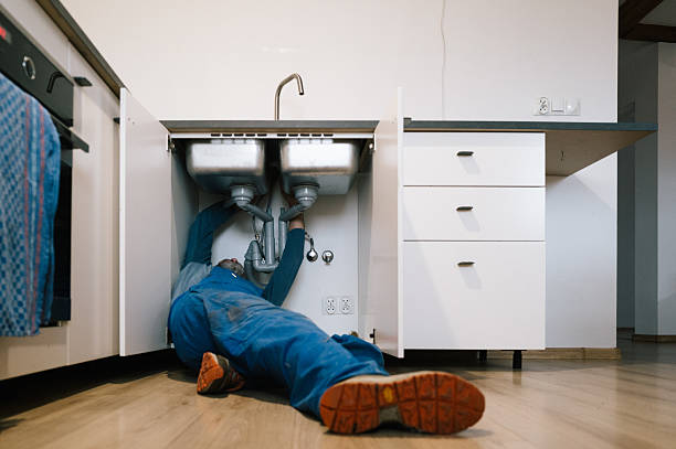 Professional Drain Cleaning technician working in Staples, TX